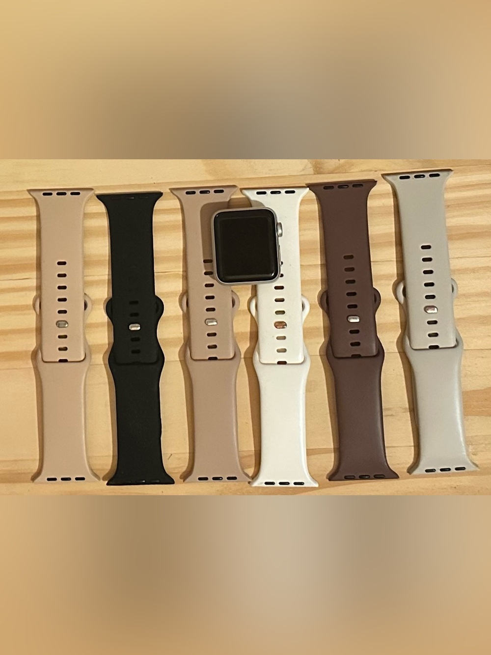 Apple Watch with Black, Beige, White and Brown Silicone Bands